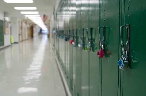 Green Lockers lining in hallway 
